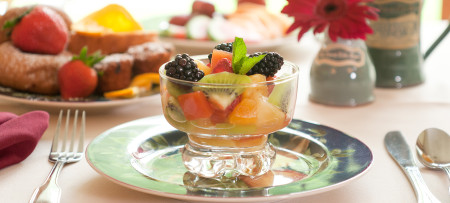 Fruit cup in glass bowl on plate