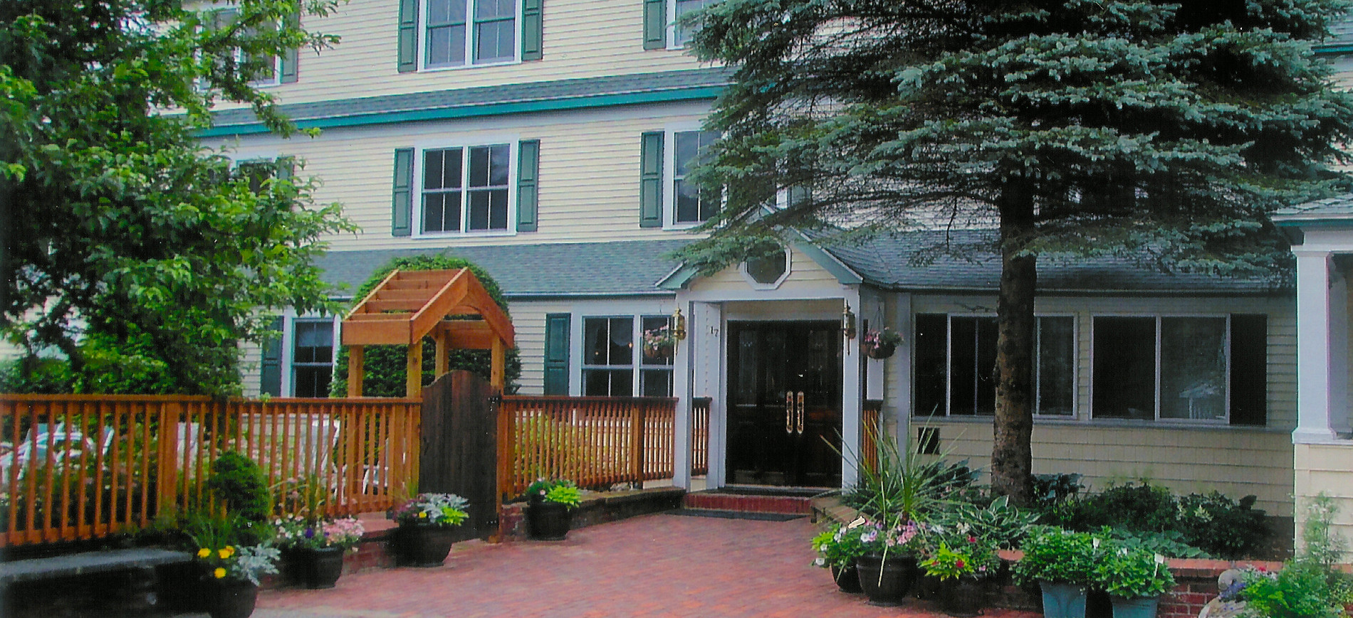 Inn at Ellis River entrance with flower pots