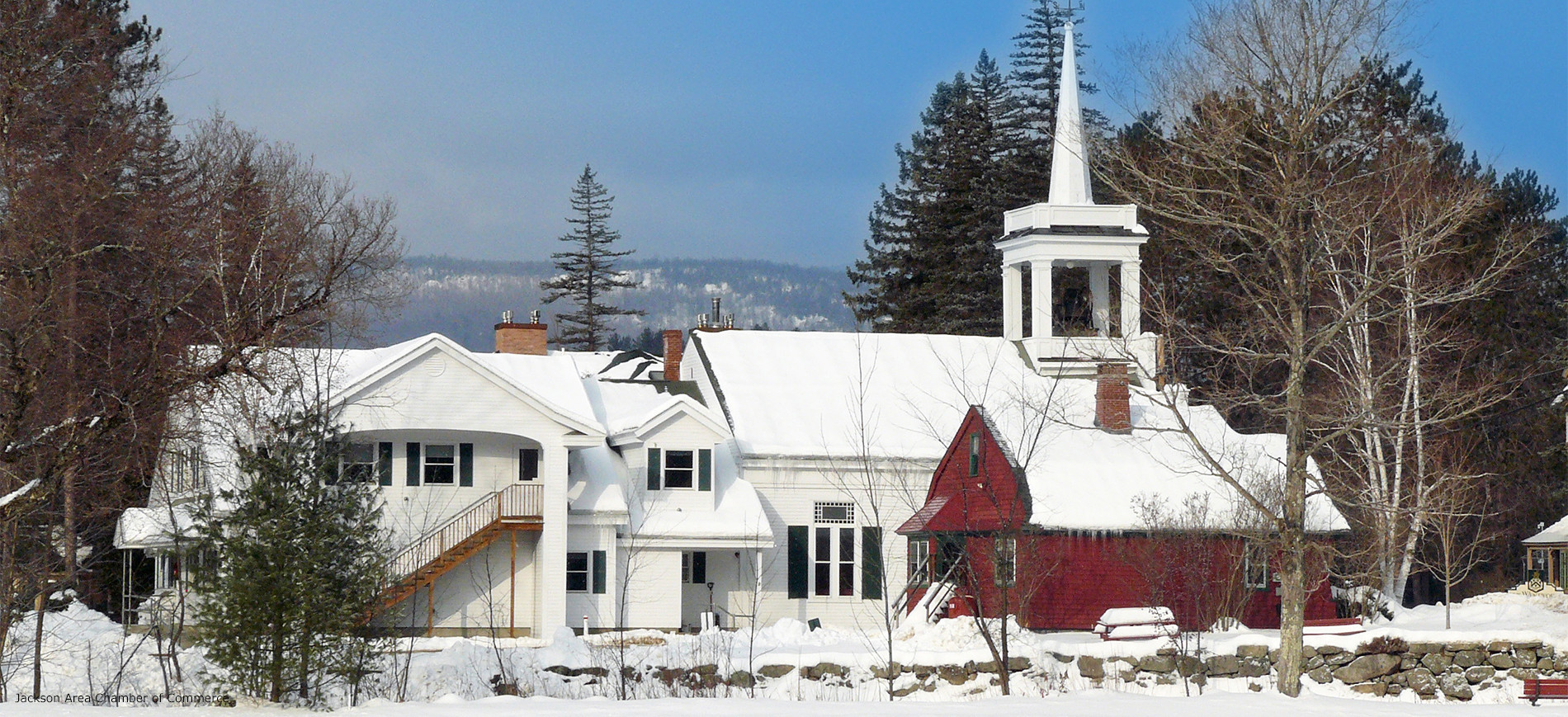 Jackson NH village scene with church in foreground & mountains in background