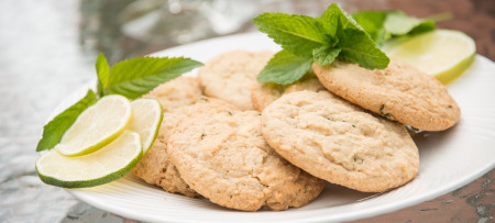 Mojitoo Cookies on white plate with mint & lime slice garnish