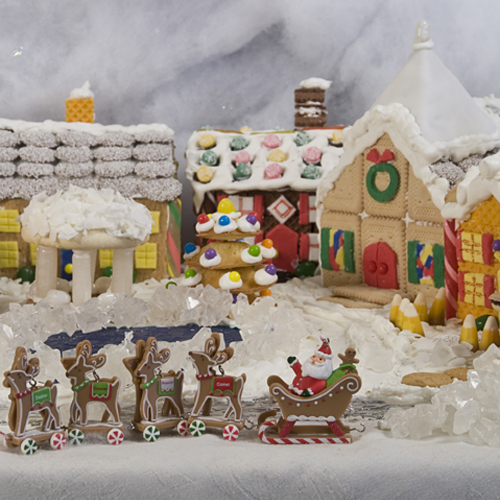 Gingerbread village with Santa sleigh, featuring a "Be an Elf" offer as seen on SmarterTravel.com
