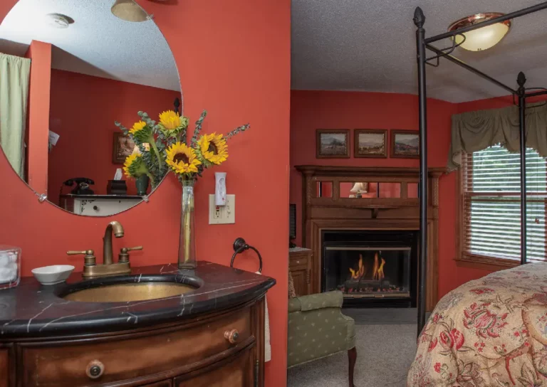 Bedroom with a bed, dresser, and mirror.