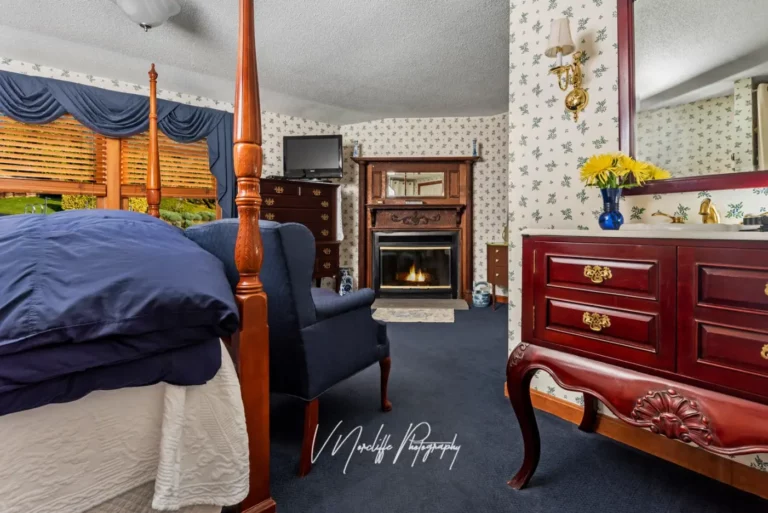 Thoreau Falls - view of fireplace-chairs-sink from bed.
